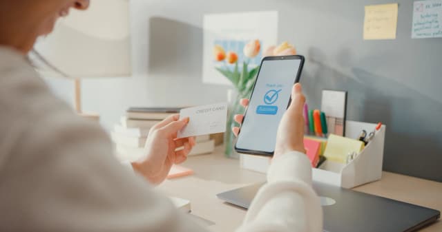 Person logging into a secure system using fingerprint and holographic interface