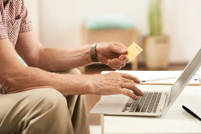 Person logging into a secure system using fingerprint and holographic interface